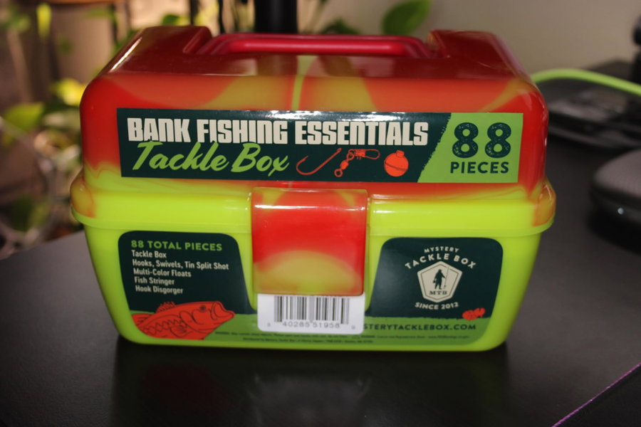 Colorful tackle box labeled "Bank Fishing Essentials" with 88 pieces.